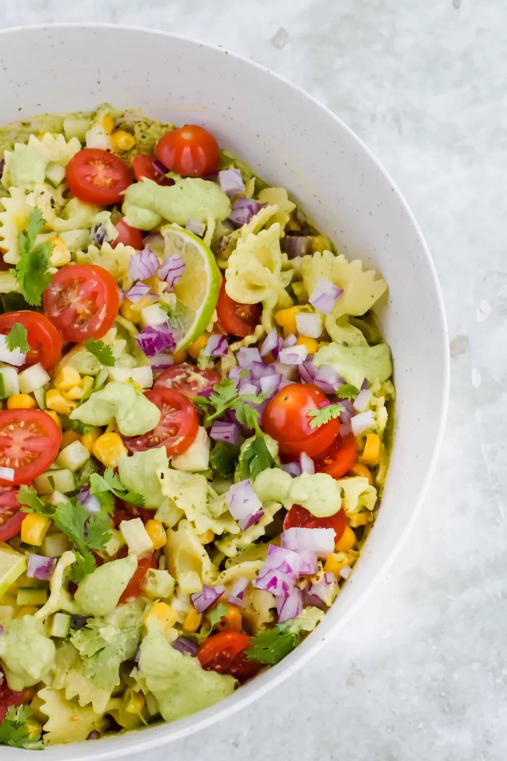 white bowl with cilantro lime pasta salad