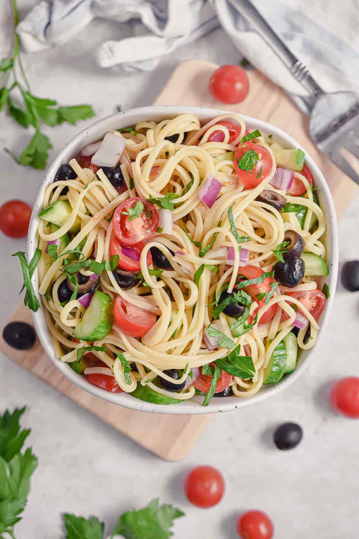 large bowl of linguine pasta salad on table