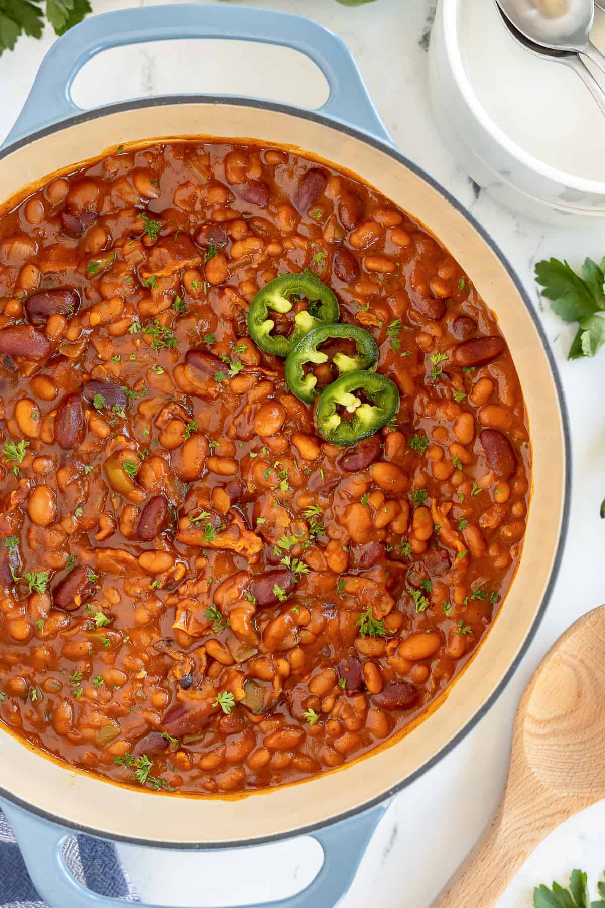 spice baked beans in a cast iron pot on a table