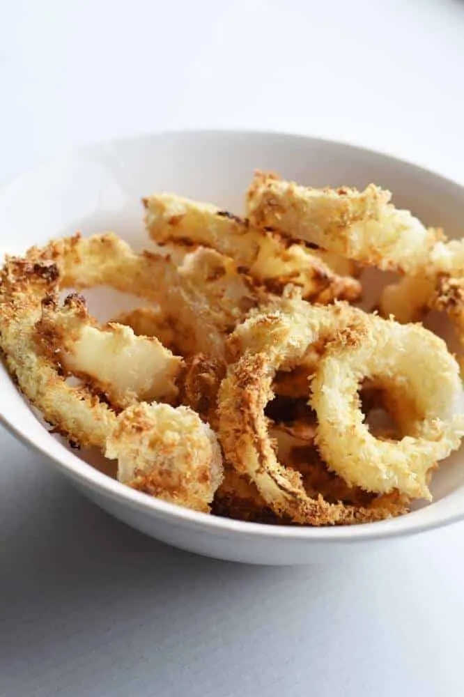 bowl of air fried onion rings ready to eat