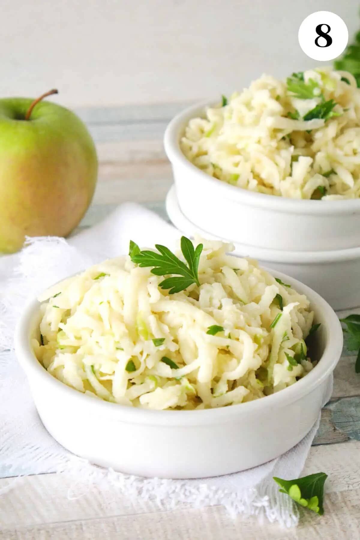 two bowls with apple jimcama slaw ready to eat