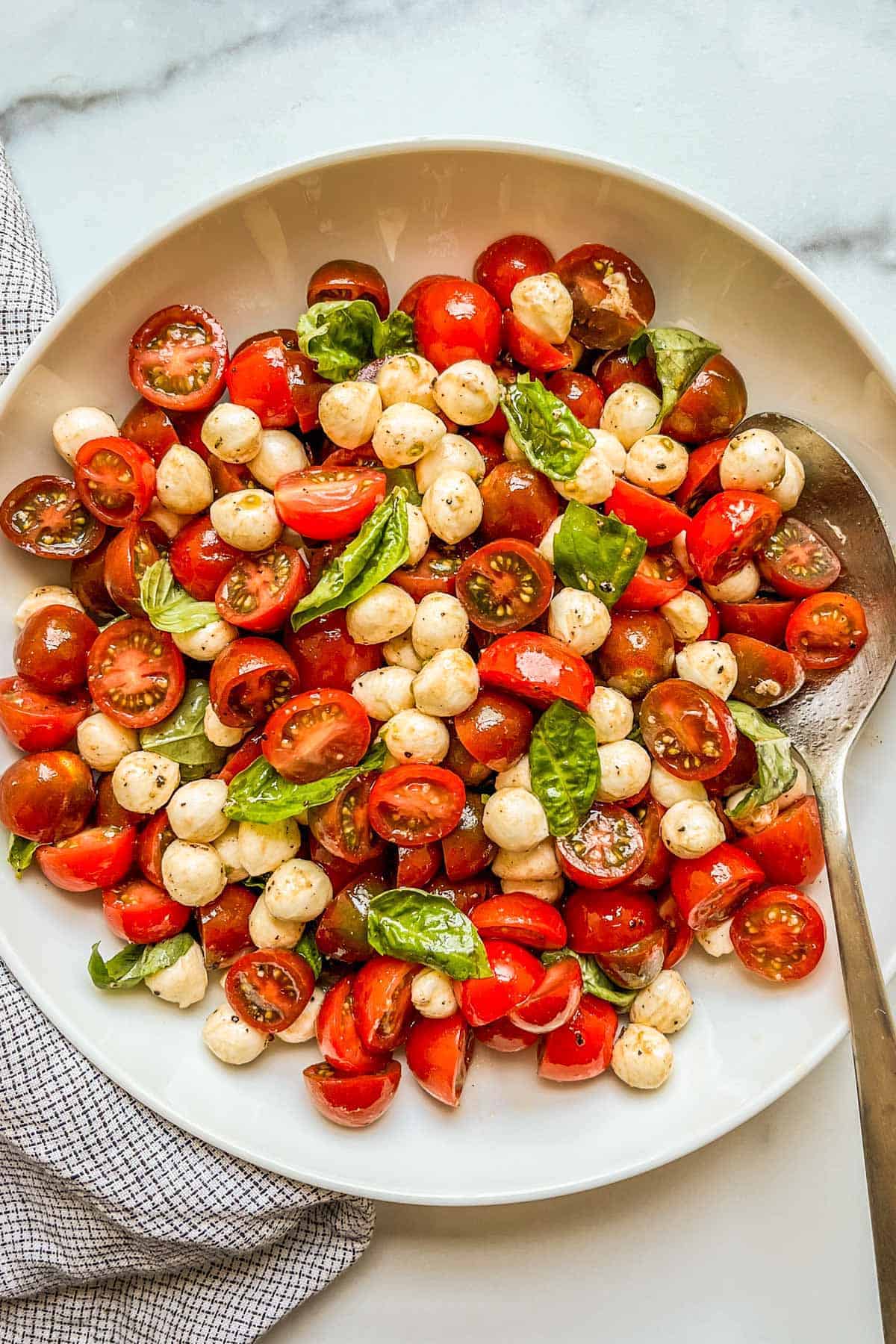 large bowl of cherry tomato caprese salad