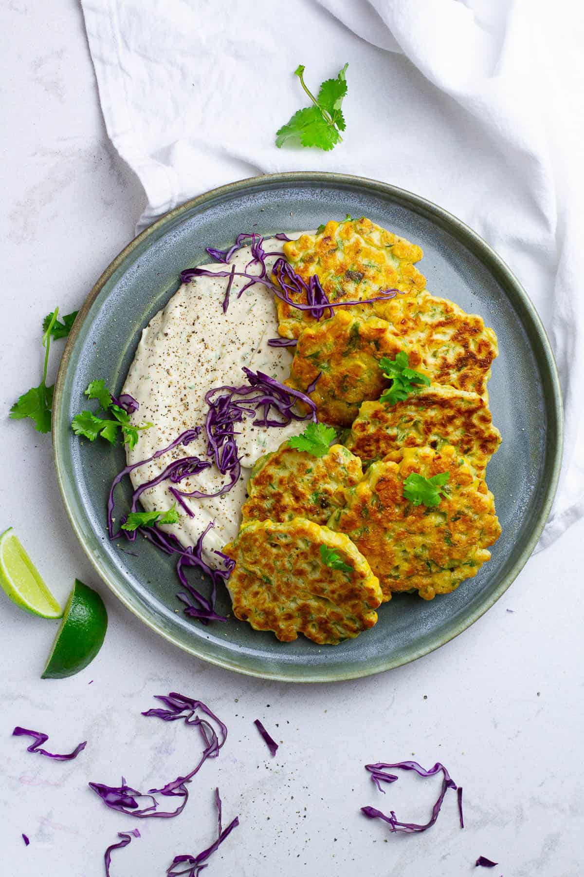 plate with corn fritters and salad