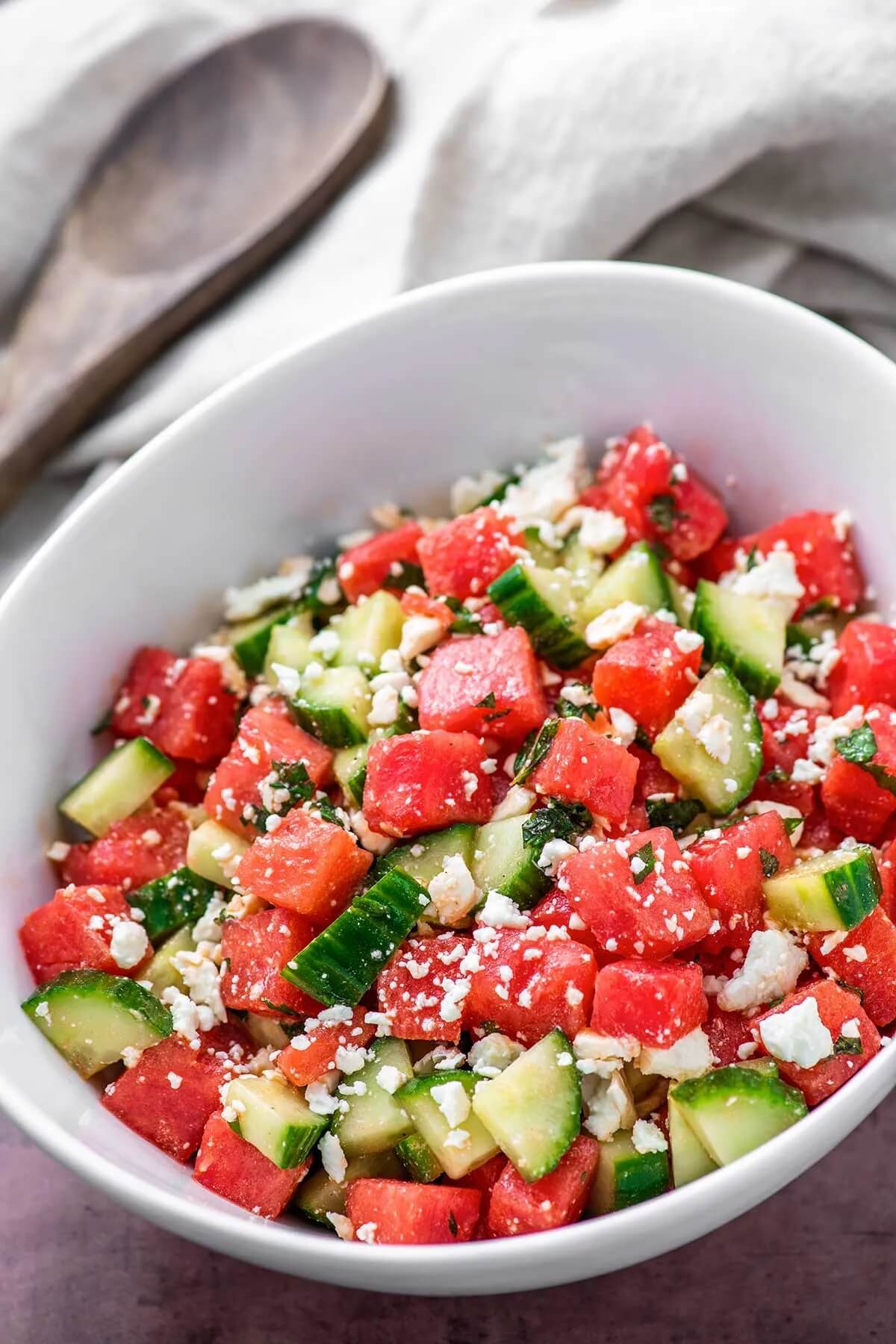 large bowl of colourful watermelon and cucumber salad
