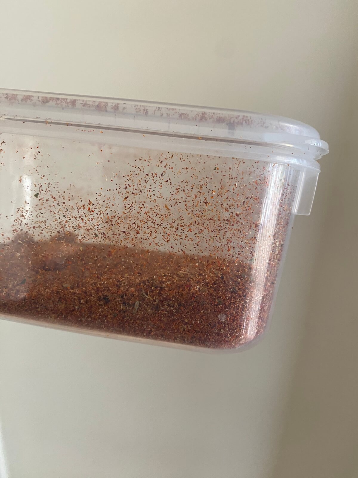 pork dry rub stored in an airtight plastic container