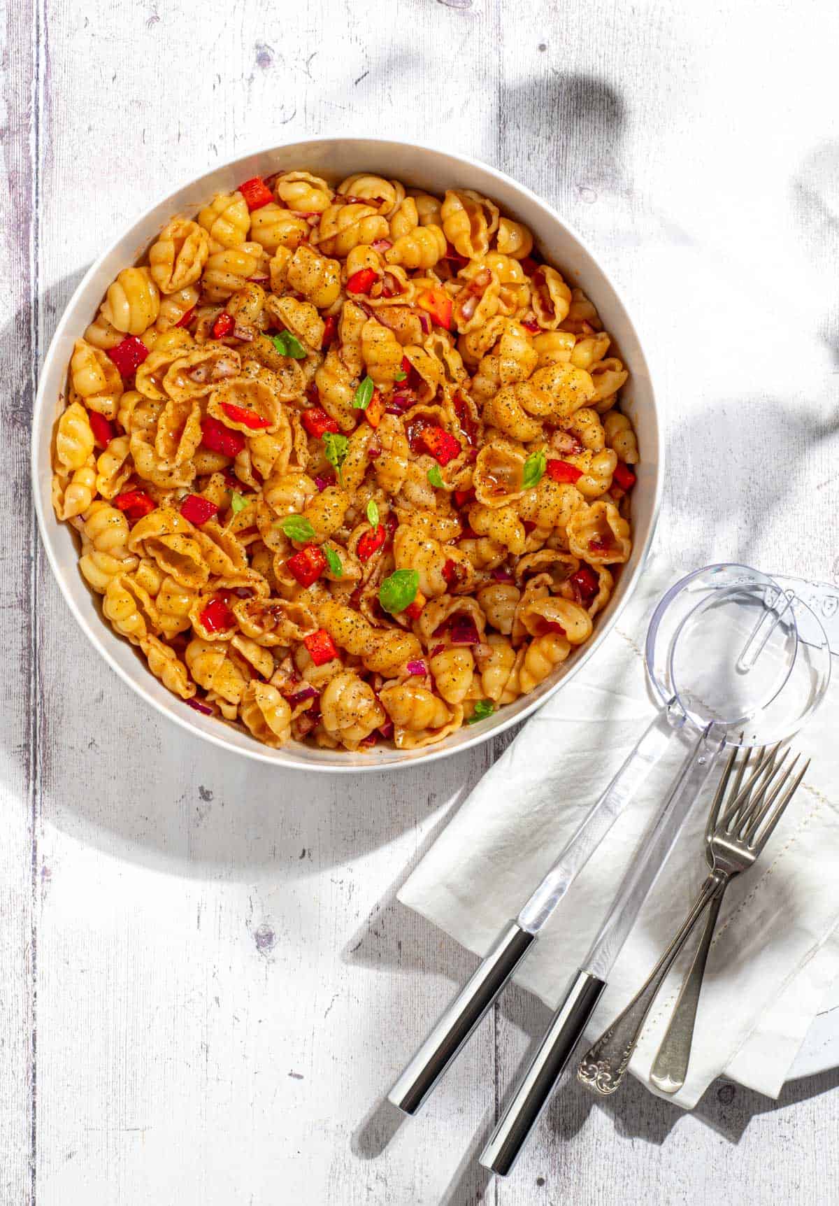 curry noodle salad in white bowl.