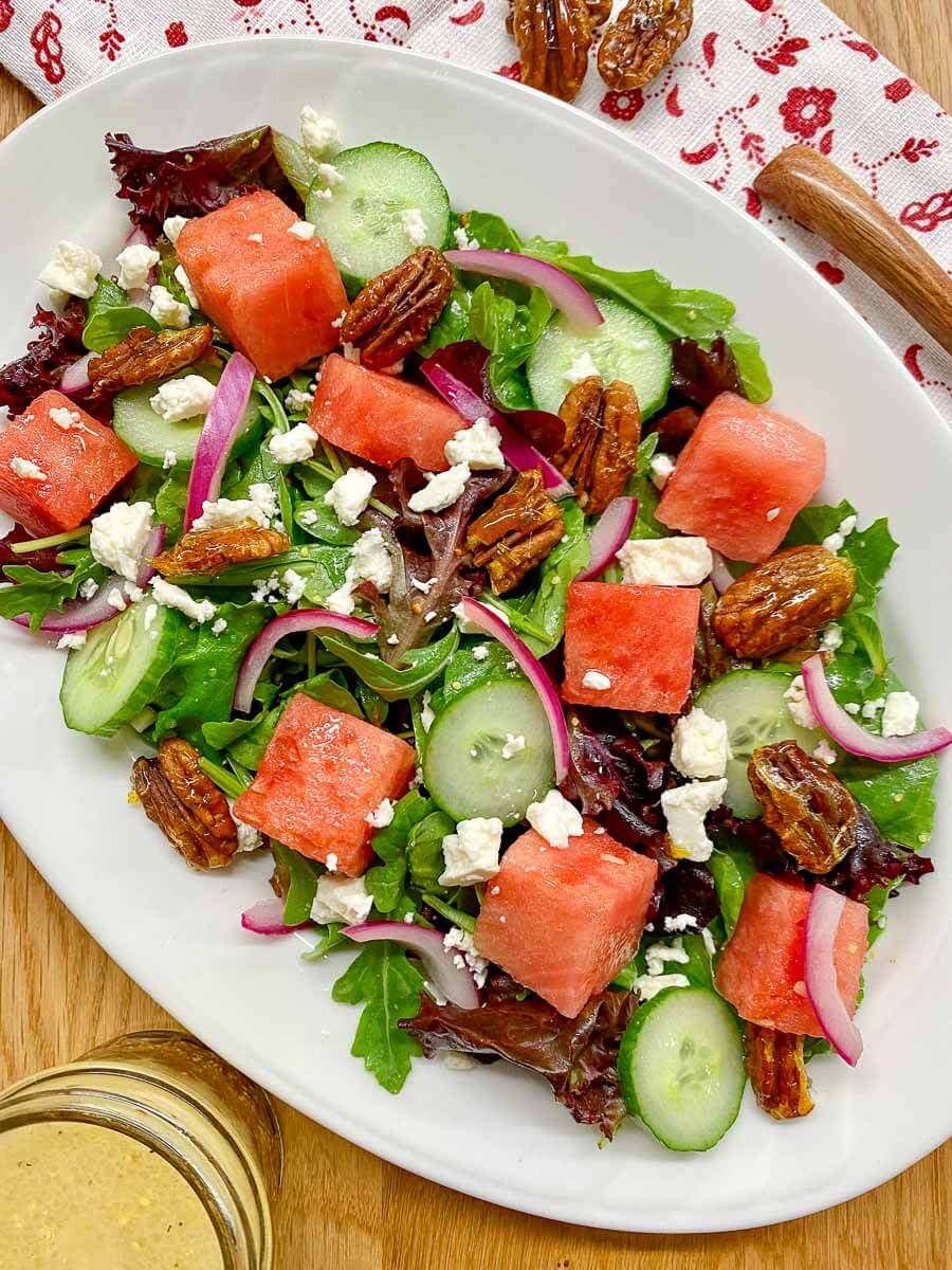 watermelon salad on a white serving platter.