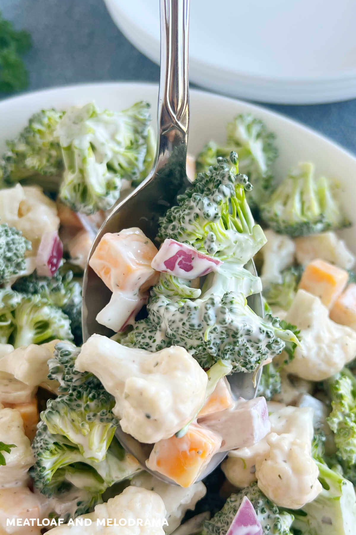 close up of broccoli cauliflower salad in bowl.