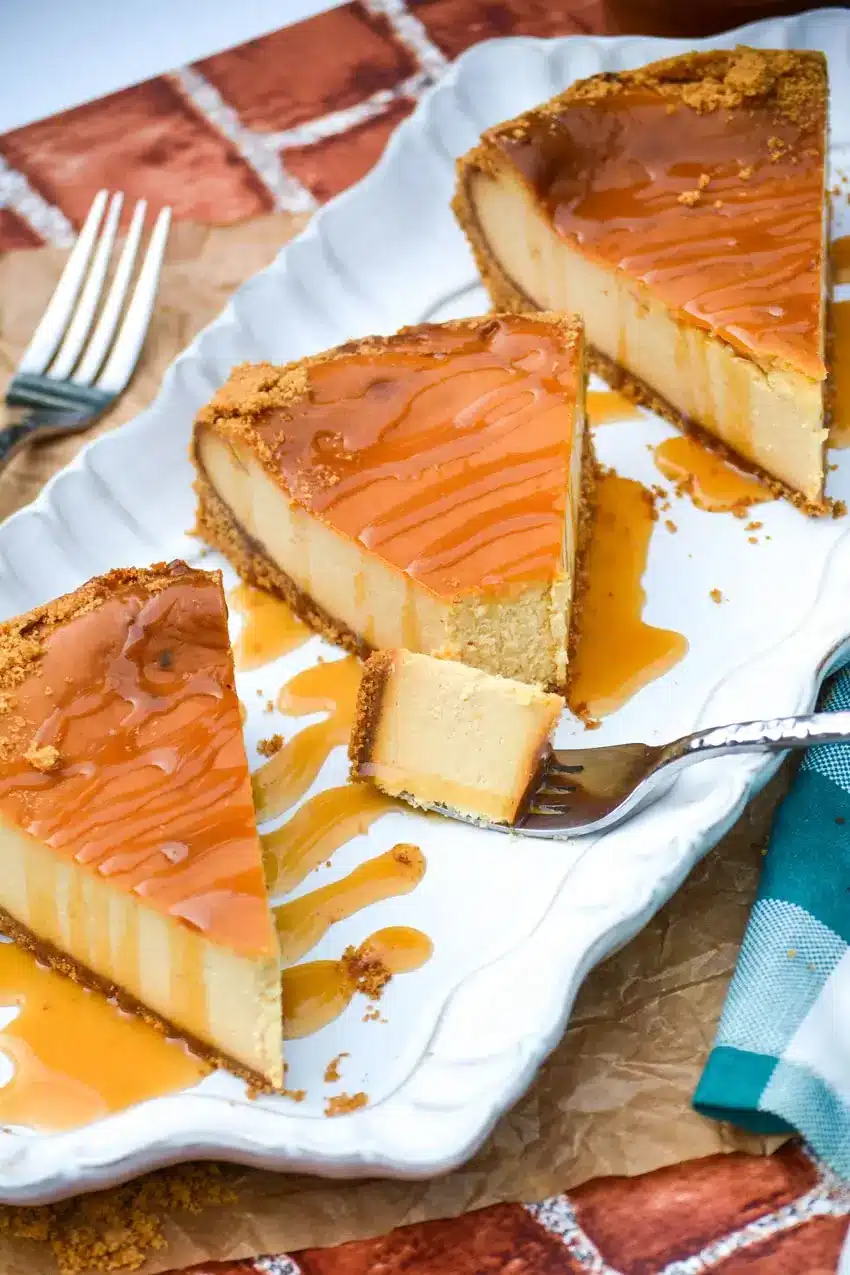 smoked cheesecake on a tray in slices.