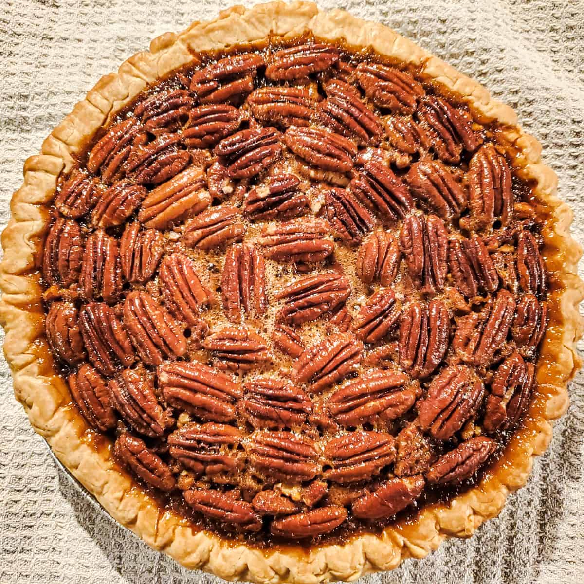 smoked maple bourbon pecan pie in tray.