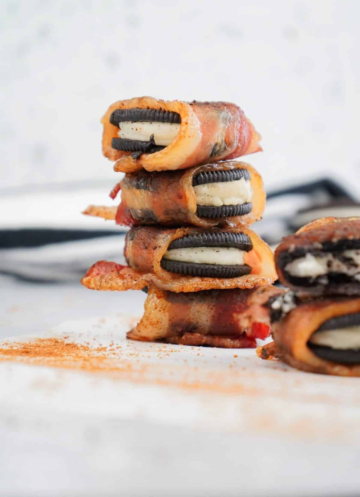 stack of bacon wrapped smoked oreos.