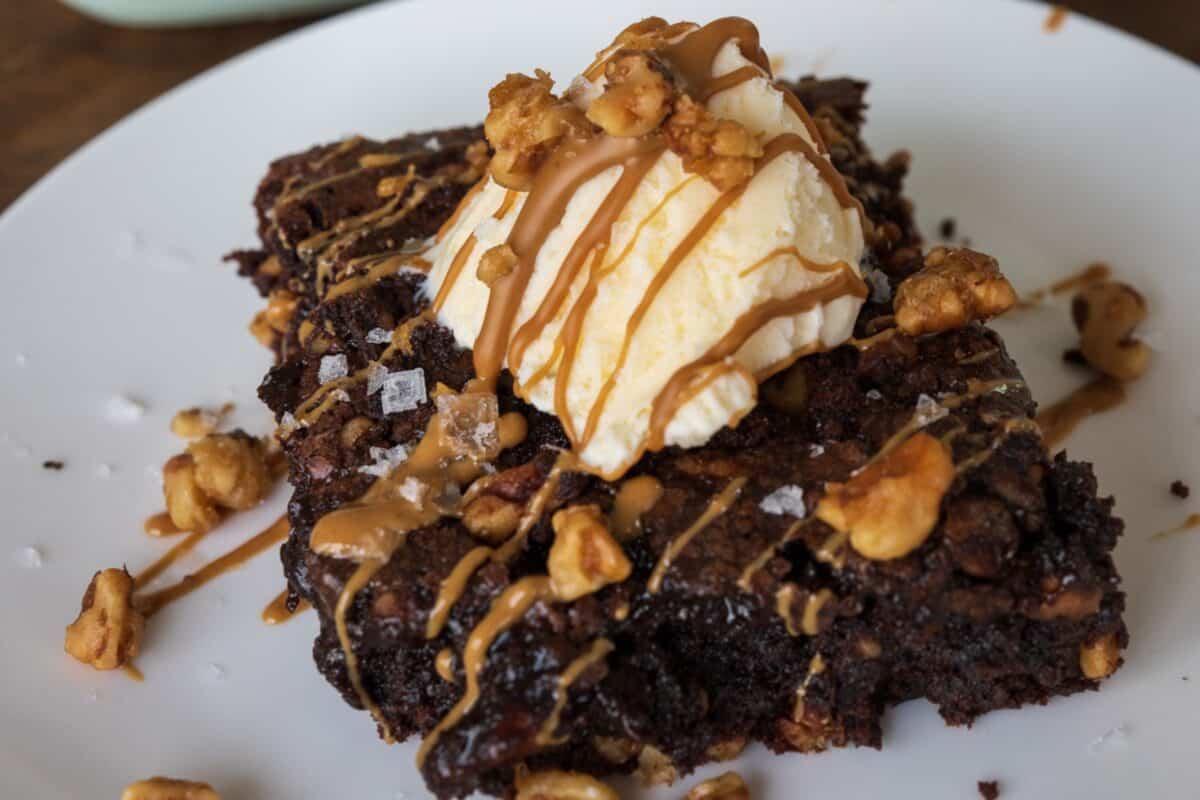 smoked traeger brownies with caramel sauce and cream.