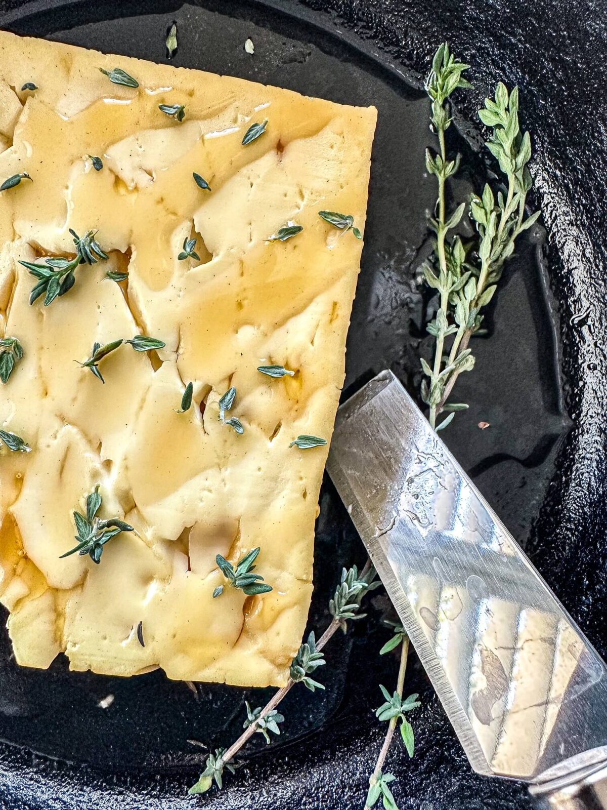 smoked feta with hot honey on serving dish.