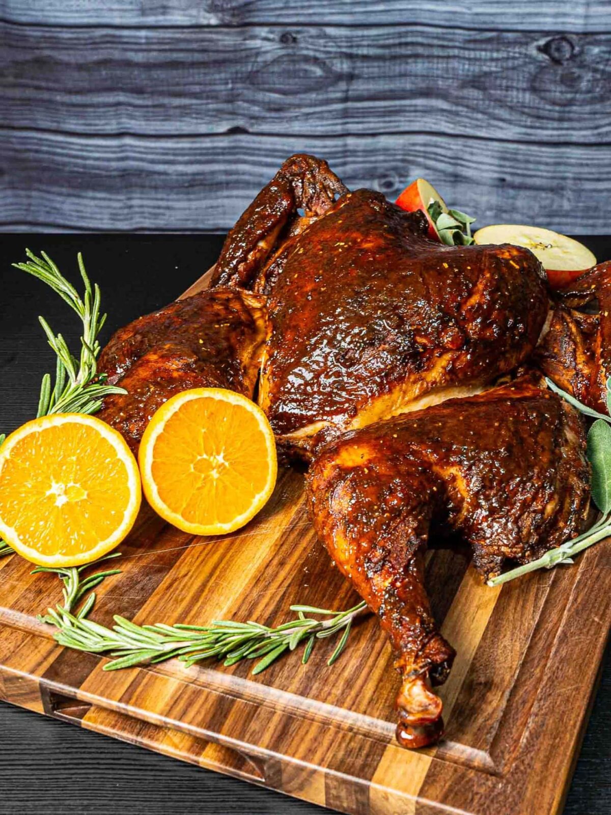 smoked turkey on wooden board.