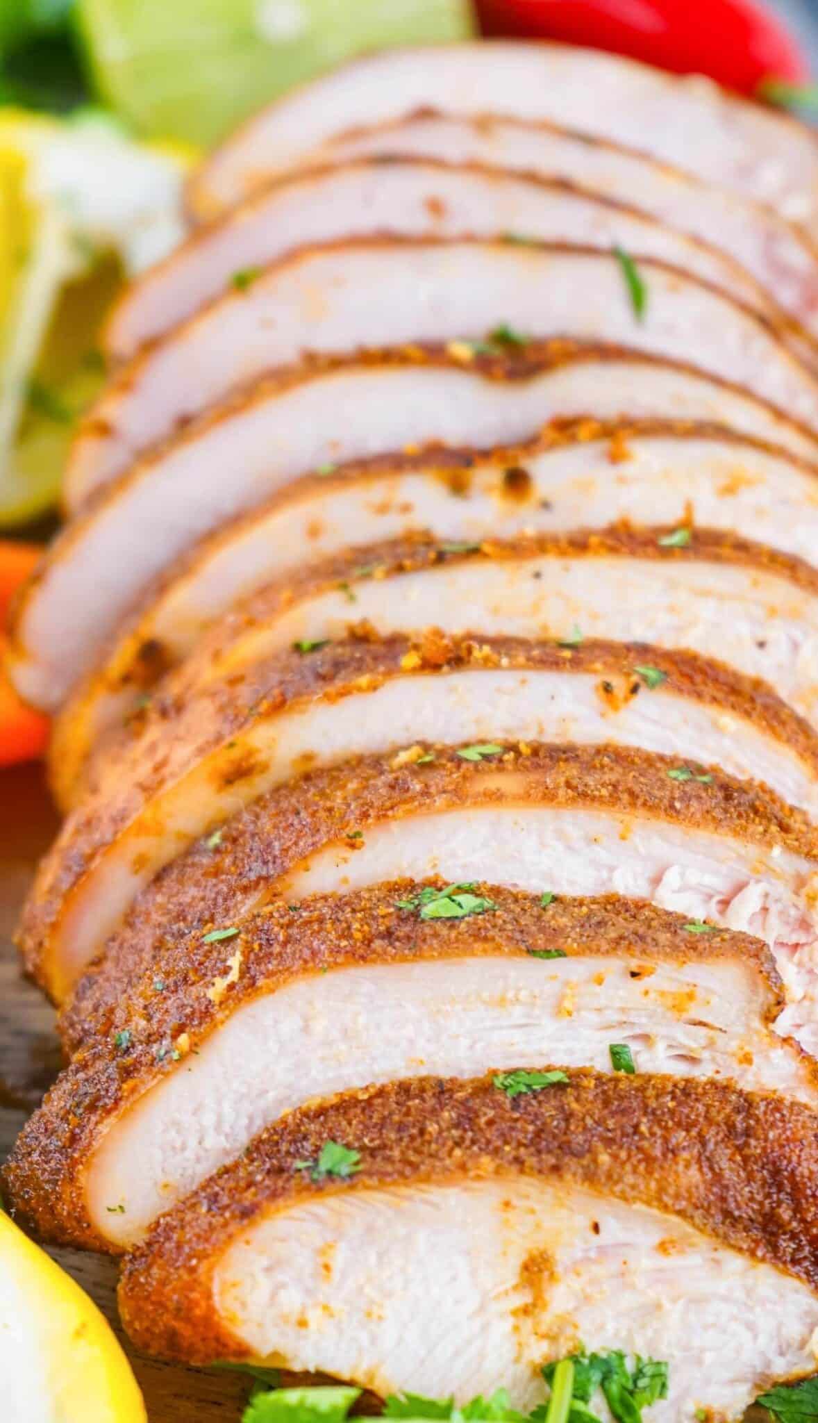 smoked turkey breast sliced on platter.